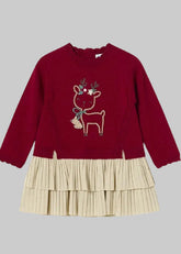 Mayoral Baby Girls Red and Gold Christmas Dress features a soft knit with long sleeves, ruffle collar, and reindeer appliqué. Back button fastening and tiered, pleated gold fleck skirt complete the festive look.