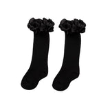 Black knee-high socks with ruffles from Carameo Kids.