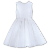 Sarah Louise Ceremonial Ballerina White Dress in a elegant sleeveless design with a V-Shaped back adorned with a pearl trim and a large bow.