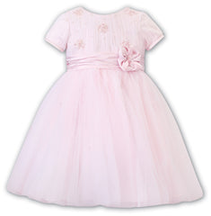 Sarah Louise Ceremonial Ballerina Dress in a delicate hand-pleated bodice with clusters of flowers adorned with pearls and a beautiful Satin flower at the waist.