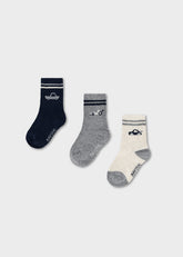 Mayoral baby boys striped socks set featuring playful car motifs across three pairs in white, blue, and grey.