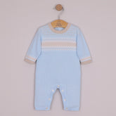 EMILE et ROSE Magnus. Perfect for winter walks, this super cosy knitted outfit in pale blue, with a simple round neck, the white and stone chevron and zig-zag Scandi design is very striking and modern. Pearlised buttons add additional interest and aid easy access for changing.