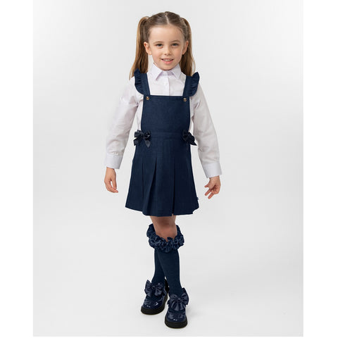 Navy pleated pinafore with bow from Caramelo Kids.