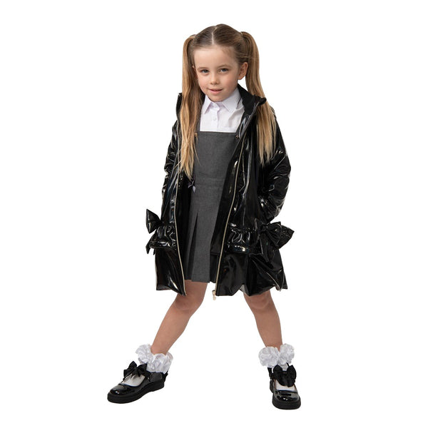 Black rain mac with bow from Caramelo Kids.