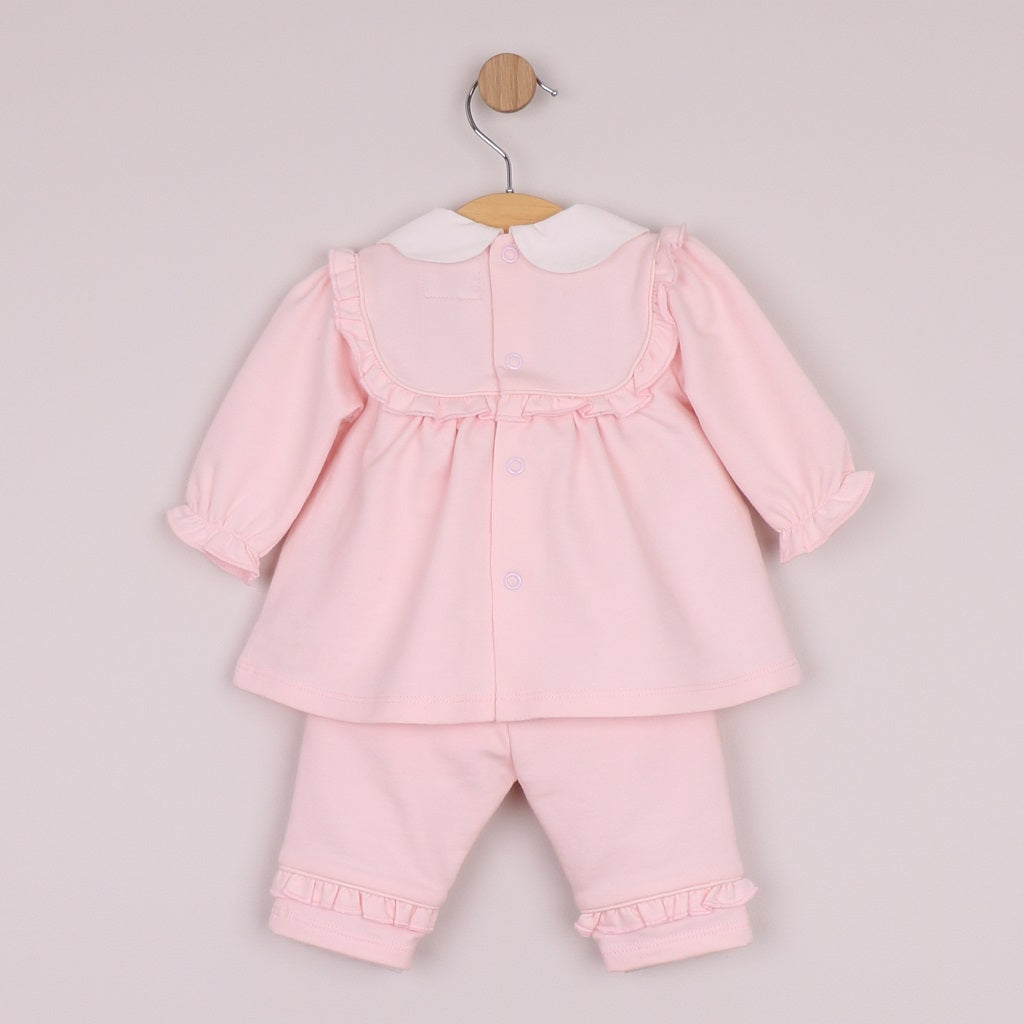 EMILE et ROSE Macey is a beautiful baby girls 2pc outfit in cosy Baby French Terry, the smock top has the same intricately embroidered, frilled inset yoke and pretty scalloped collar. On the trouser, the same frill from the yoke decorate each leg, very feminine.