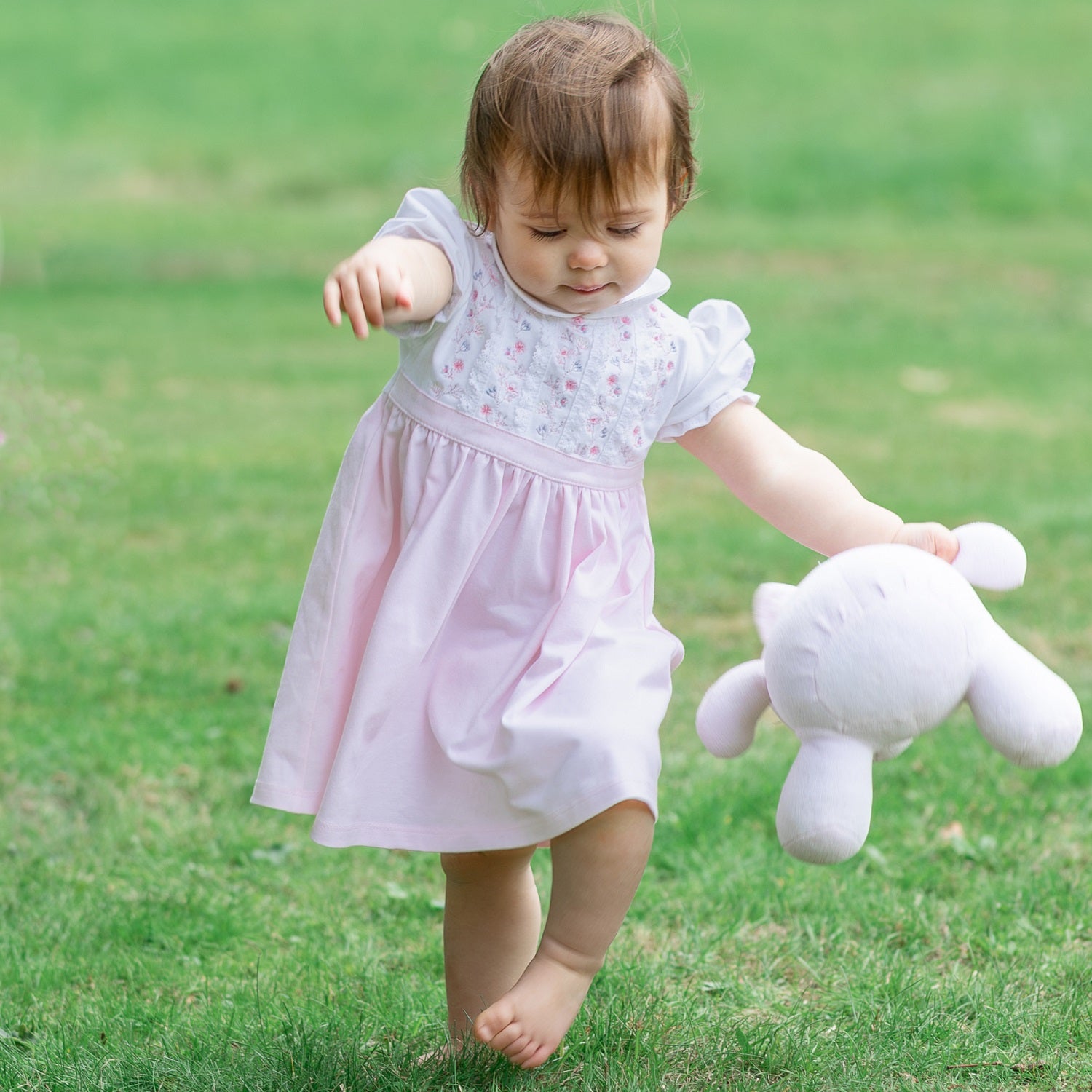 EMILE ET ROSE LILAH The top half of this beautiful dress is white with alternate columns of gorgeous embroidery in shades of pink & grey and intricate lace running vertically from collar to waist.