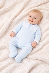 The Harry all-in-one in soft pale blue offers timeless elegance for baby boys, crafted by PASTELS & Co.