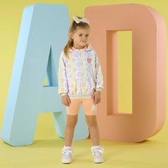 ADEE Sisi hoody cycling set features an initial print hoody with a sequined heart artwork, paired with peach cycling shorts