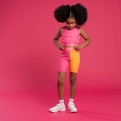 BONINI by ADee The Flex colour block crop top features logo tape cross back straps and is designed to match pieces within the collection. Hot Pink