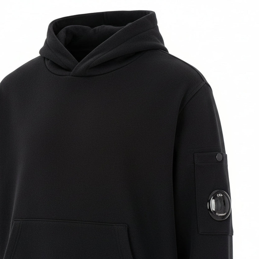 C.P. Company boys' U16 diagonal fleece adjustable hooded sweatshirt with iconic lens detail, kangaroo pocket with ribbed cuffs and hem. Regular fit. Black