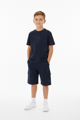 Short sleeved ribbed crewneck t-shirt wth chest applied logo patch. Shorts adjustable drawstring waistband with side pockets. Front printed logo. Cargo flap snap pockets. Regular fit. Eclipse Blue