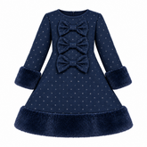 A navy blue long-sleeve navy blue diamante dress for toddlers and girls featuring three large decorative diamante bows on the front, and plush faux-fur trim on the cuffs and hem.