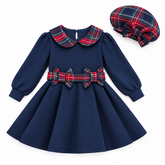 Girl navy blue dress with red, green, and yellow plaid collar and double bow waistband. Comes with matching plaid hat