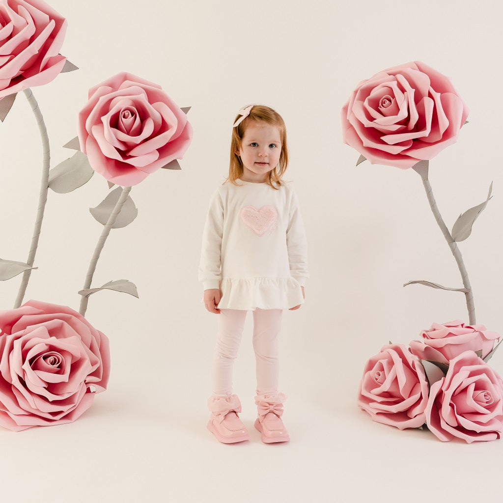 LITTLE A by ADee Little Bloom theme. The Demi legging set features a long sleeve jumper top with a sweet heart detail and peplum frill hem, paired with soft leggings finished with a subtle motif