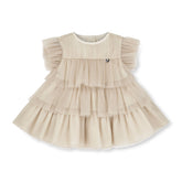 LITTLE A by ADee Little Locket theme. The Ella dress features layered tulle frills and flutter sleeves. Finished with a tiered skirt for a beautifully floaty, dressy look. Stone Beige