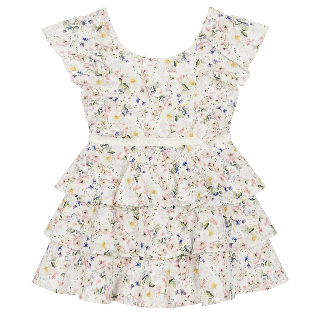 LELLI KELLY Aria Printed Ruffle Dress—a delightful blend of floral prints and elegant ruffles that captures attention and turns heads wherever she goes. Logo on waistband.