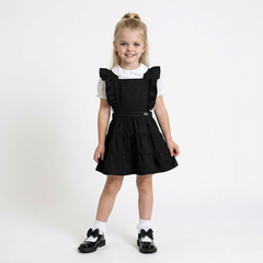 LELLI KELLY Bryony Black Frill Pinafore featuring cross over strap detail on the back and charm with LELLI KELLY logo on the front
