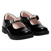 LELLI KELLY Taylor shoes in classic black patent leather, featuring charming diamante dog straps that add a playful touch. The interchangeable straps