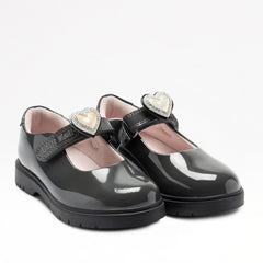Lelli Kelly Sabrina comes in a grey patent upper. Sabrina has a hook and loop fastening. A large enamel heart with a diamate framed charm, sits on the strap fastening which changes colour in the sunlight. The charm can be slid off and replaced with a large bow. Pink textile lining and chunky sole unit completes the look.