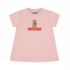 MOSCHINO Baby Pink Dress with Heart & Teddy Bear Logo A charming pink dress for baby girls, featuring the iconic MOSCHINO heart and teddy bear logo.
