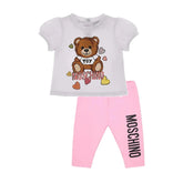 Moschino Baby Girls white teddy t-shirt a with sweet pink jersey leggings with elastic waist, decorated with a black logo on the leg.