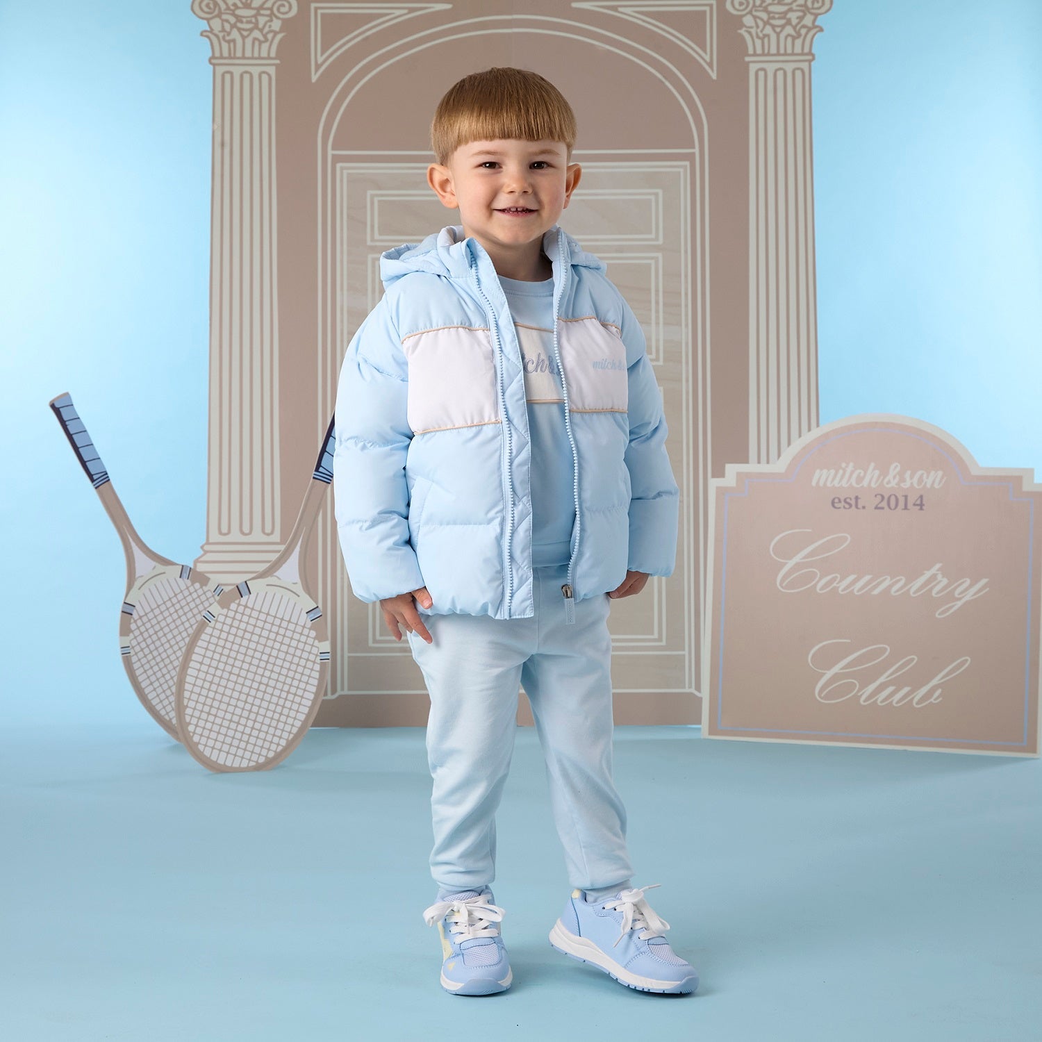 MITCH & SON Classic Collection. The Steven padded jacket with hood and two pockets at the front, with a white panel design across the front. Finished with a front zip fastening, branded puller, and signature logo print. Sky Blue