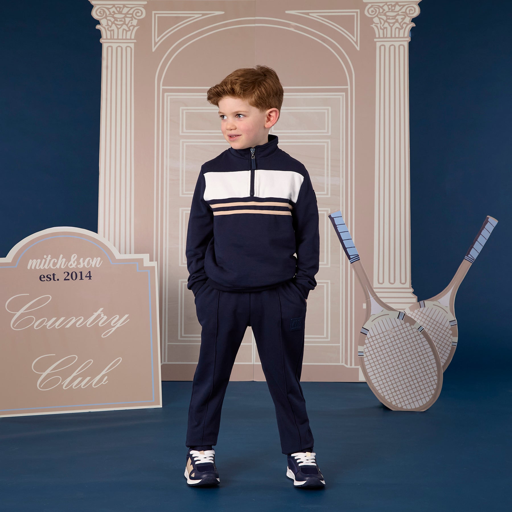 MITCH & SON Classic Collection. The Samson tracksuit features a sleek colour block design with a 1/4 zip top and coordinating joggers. Designed with elasticated trims for comfort and finished with understated logo detailing. Dark Navy
