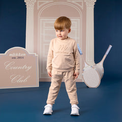 MITCH &SON Classic Collection. The Seth tracksuit features a sweatshirt with subtle embossed logo detailing and matching joggers. Designed with ribbed trims for a comfortable, easy fit. Stone Beige