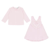 Pastels & Co - Hearts & Bows Story. The Mia puff ball dress in soft pale pink offers timeless elegance for baby girls.