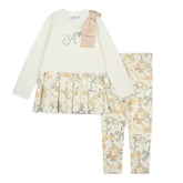 ADEE Eau-de Adee Collection. The Blake legging set features a frill-detail all-over print long-sleeve top with an appliqué shoulder bow and Adee diamante branding, paired with matching printed leggings. Snow White/Beige