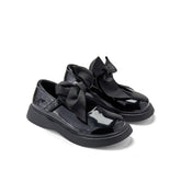ADEE The Lyra shoe is perfect for school, with pretty bows on the velcro strap and embroidered logo to the side. Finished with non-slip rubber soles. Black