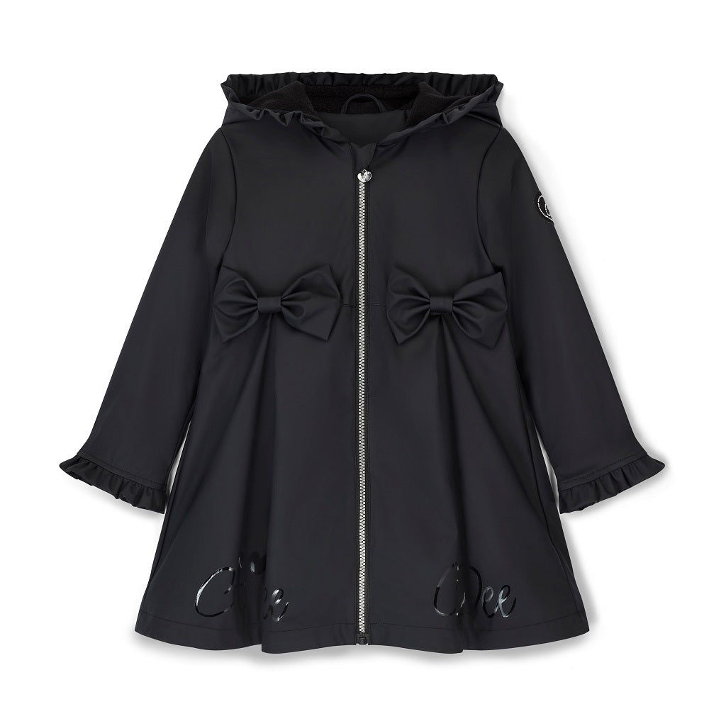 ADEE BTS The Nova is the must-have back to school raincoat! It features front and back pleats with pretty bow detailing, branding around the hem and frills at the cuffs and hood. Complete with a silver reflective logo badge on one arm and a silver branded puller. Black