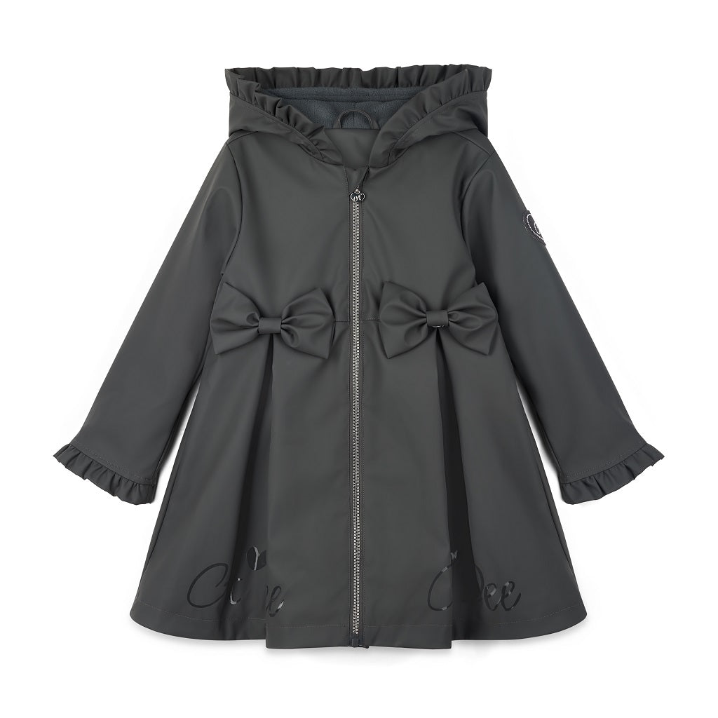 ADEE BTS The Nova is the must-have back to school raincoat! It features front and back pleats with pretty bow detailing, branding around the hem and frills at the cuffs and hood. Complete with a silver reflective logo badge on one arm and a silver branded puller. Dark Grey