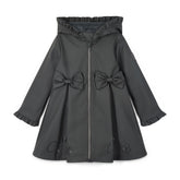 ADEE BTS The Nova is the must-have back to school raincoat! It features front and back pleats with pretty bow detailing, branding around the hem and frills at the cuffs and hood. Complete with a silver reflective logo badge on one arm and a silver branded puller. Dark Grey