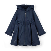 ADEE BTS The Nova is the must-have back to school raincoat! It features front and back pleats with pretty bow detailing, branding around the hem and frills at the cuffs and hood. Complete with a silver reflective logo badge on one arm and a silver branded puller. Dark Navy