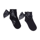 ADEE pixie ankle socks with a satin frill detail around the cuff, adding a touch of style to any outfit. Black