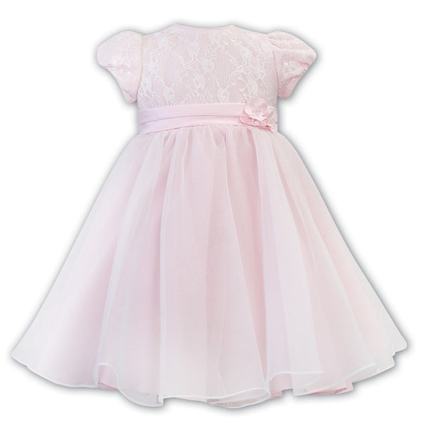 Sarah Louise Classic Ballerina Dress a beautiful tulle layer with hand-stitched lace, a satin ribbon and a delicate flower on the waistline.