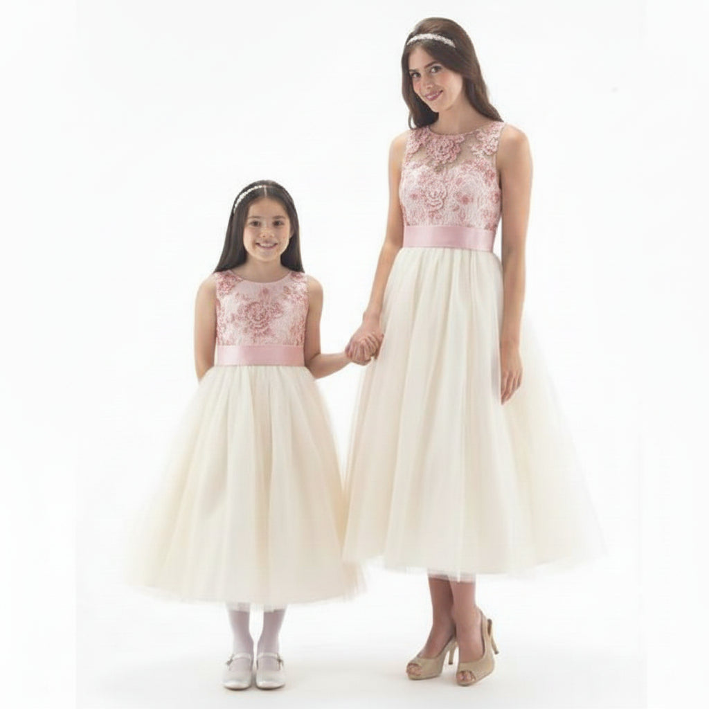 LINZI JAY Girls tea length dress with lace bodice and tulle overlay skirt. Satin pleated waistband. Zip fastening up back.