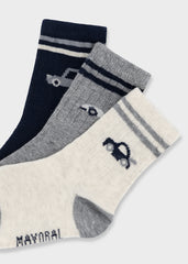 Mayoral baby boys striped socks set featuring playful car motifs across three pairs in white, blue, and grey.