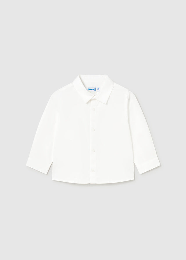 Classic white cotton shirt for baby boys. Long sleeves with button-down front. Soft, breathable fabric ideal for everyday wear or dressing up.