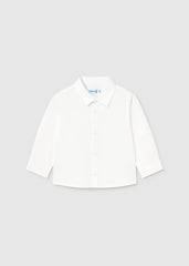 Classic white cotton shirt for baby boys. Long sleeves with button-down front. Soft, breathable fabric ideal for everyday wear or dressing up.