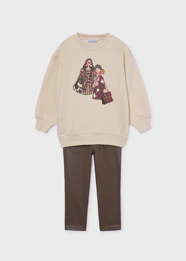 Mayoral Girls Coordinated two-piece outfit featuring a girls fashion print top paired with blotch print leggings. Perfect for everyday wear. Chestnut