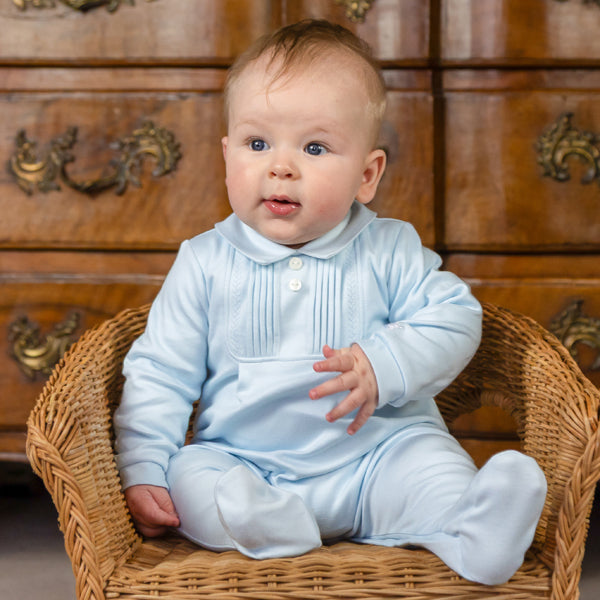 Emile et Rose Michael is a lovely baby boys’ outfit that represents traditional baby clothes at their best. A beautifully embroidered, square yoke with feather stitch embroidery and tiny vertical pintuck pleats, take centre stage. Framed by a little collar, two pearlised buttons and a cosy matching pull on hat add lovely finishing touches to this set.