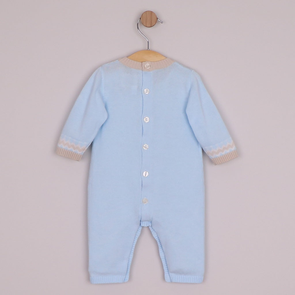 EMILE et ROSE Magnus. Perfect for winter walks, this super cosy knitted outfit in pale blue, with a simple round neck, the white and stone chevron and zig-zag Scandi design is very striking and modern. Pearlised buttons add additional interest and aid easy access for changing.