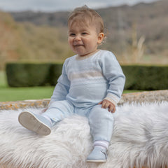 EMILE et ROSE Magnus. Perfect for winter walks, this super cosy knitted outfit in pale blue, with a simple round neck, the white and stone chevron and zig-zag Scandi design is very striking and modern. Pearlised buttons add additional interest and aid easy access for changing.