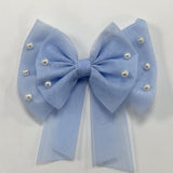 Girls Pearl Hairbow with alligator clip from Caramelo Kids.