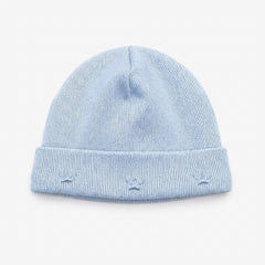 Handcrafted beanie hat in Peru with charming embroidered crowns motif in blue and gold. A special gift for a new baby boy from the Adriana Mae Celeste Reale Collection. Pima Cotton