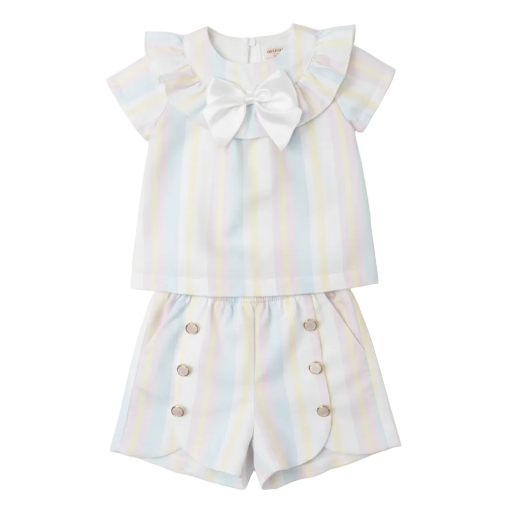 Caramelo Kids Rainbow-striped short set, perfect for summer outings. The charming ruffled collar is enhanced with a satin bow. A comfortable elasticated waistband ensures a secure and comfortable fit. 