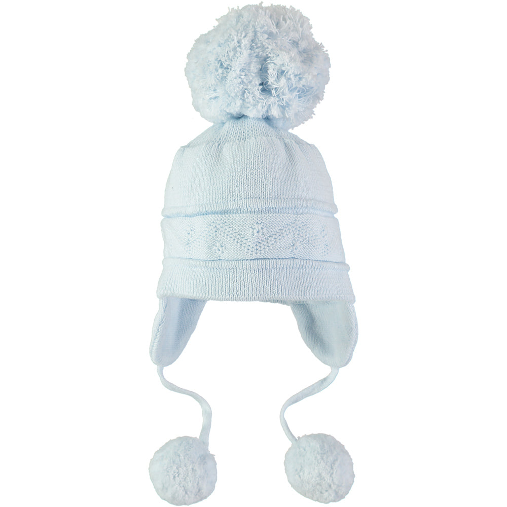 EMILE et ROSE Griffin - Baby blue knitted helmet-shaped hat with ear flaps and small pompoms trimming the ends of the ties below each ear. The main feature is the fun, over-size pompom on the top!