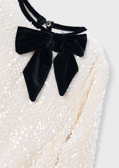 Mayoral sequin dress for girls featuring a charming bow detail.